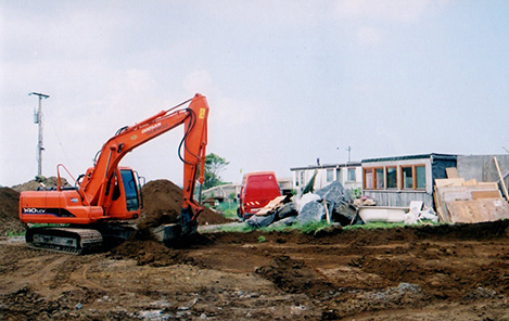 excavating the ground for the mud and wood house